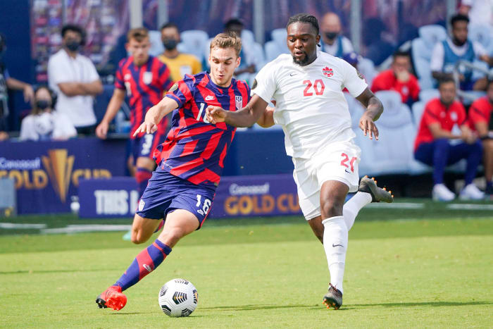 USA's James Sands and Canada's Ayo Akinola at the Concacaf Gold Cup